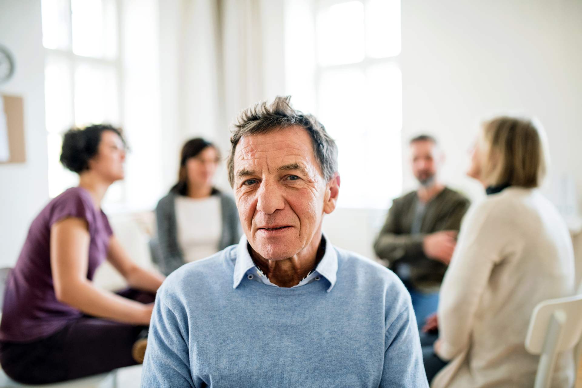 Senior man in a support group.